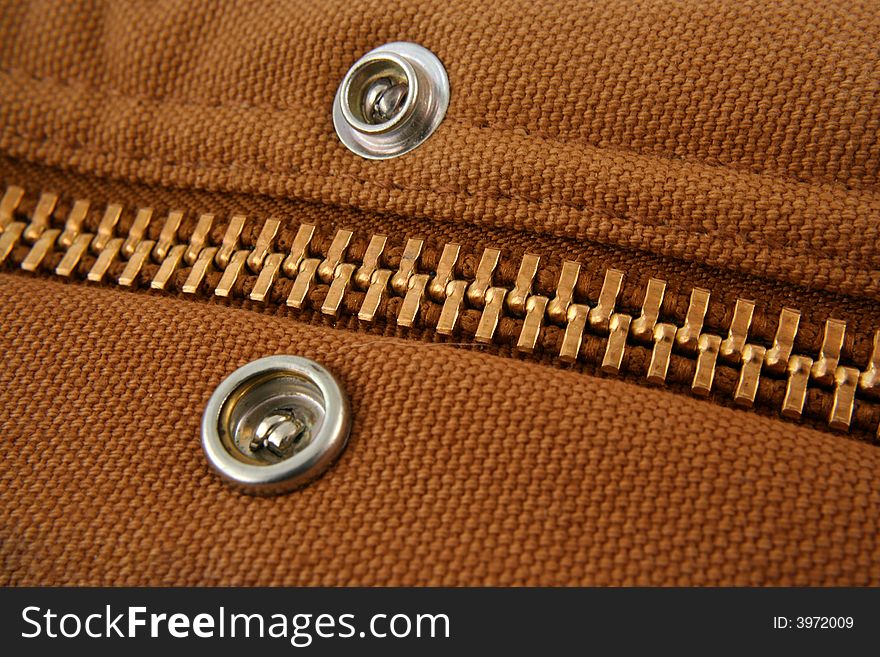 A Large gold zipper macro with snaps