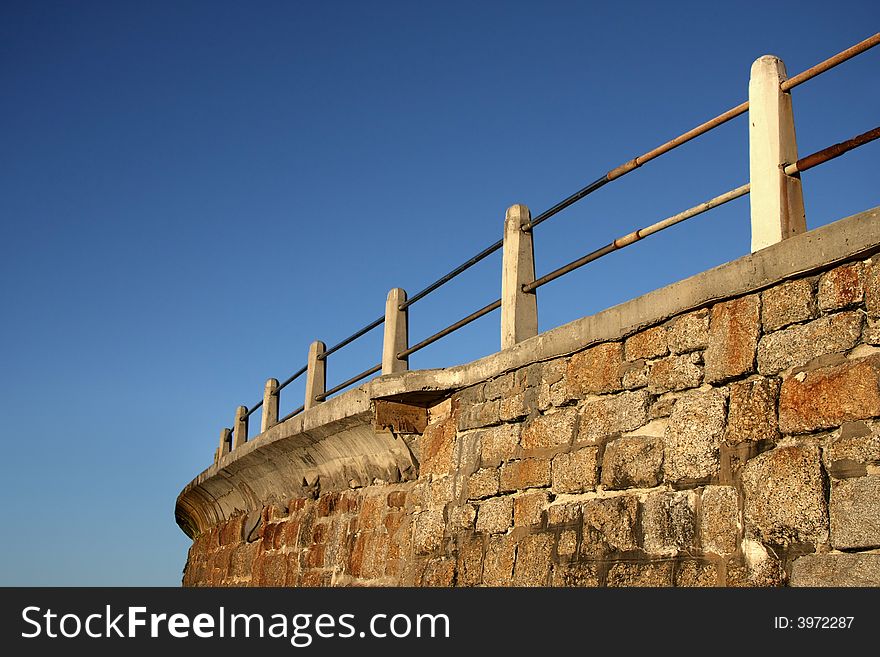 Landscape photo of a coastal sea-wall. Landscape photo of a coastal sea-wall