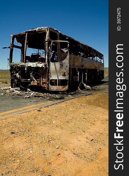 Burnt bus found on the side of the road in the karoo , south africa. Burnt bus found on the side of the road in the karoo , south africa