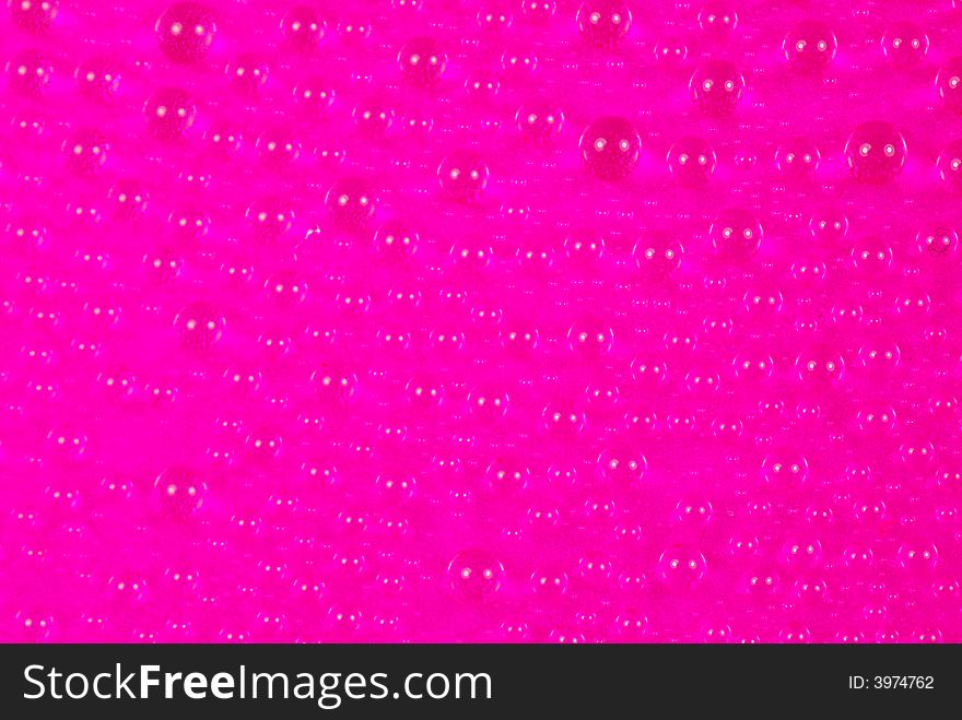 Close up shoot of pink colored water drops. Close up shoot of pink colored water drops