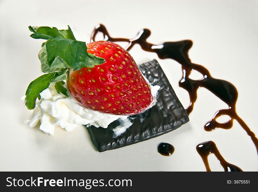 A tasty strawberry dessert isolated on black. A tasty strawberry dessert isolated on black