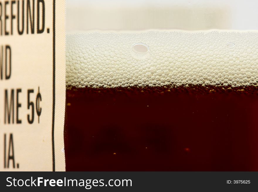 Close-up of a dark beer bottle and label. Close-up of a dark beer bottle and label.