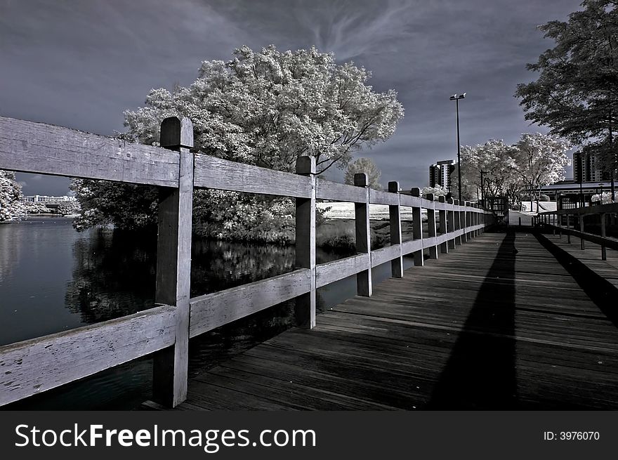 Infrared Photo â€“ Tree, Wooden Bridge And River