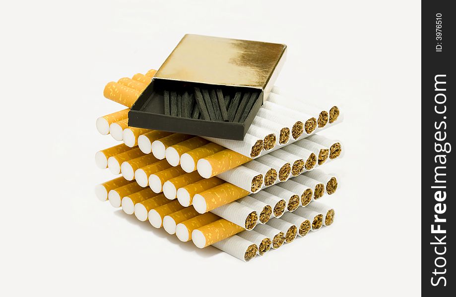 A box of matches on top of cigarettes