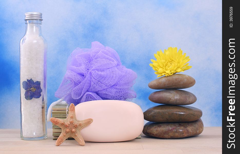 Soap and Massage Stones on Blue Textured Background. Soap and Massage Stones on Blue Textured Background