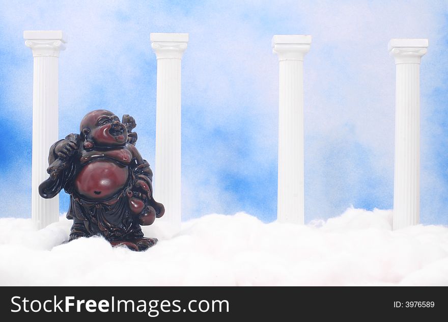 Buddha With Columns and Cotton on Blue and White Textured Background. Buddha With Columns and Cotton on Blue and White Textured Background