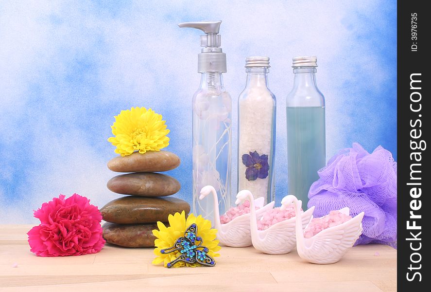 Bath Salts and Soap With Flower on Blue Textured Background. Bath Salts and Soap With Flower on Blue Textured Background