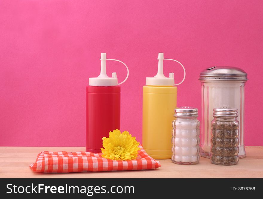 Ketchup, Mustard and Sugar on Pink Textured Background. Ketchup, Mustard and Sugar on Pink Textured Background
