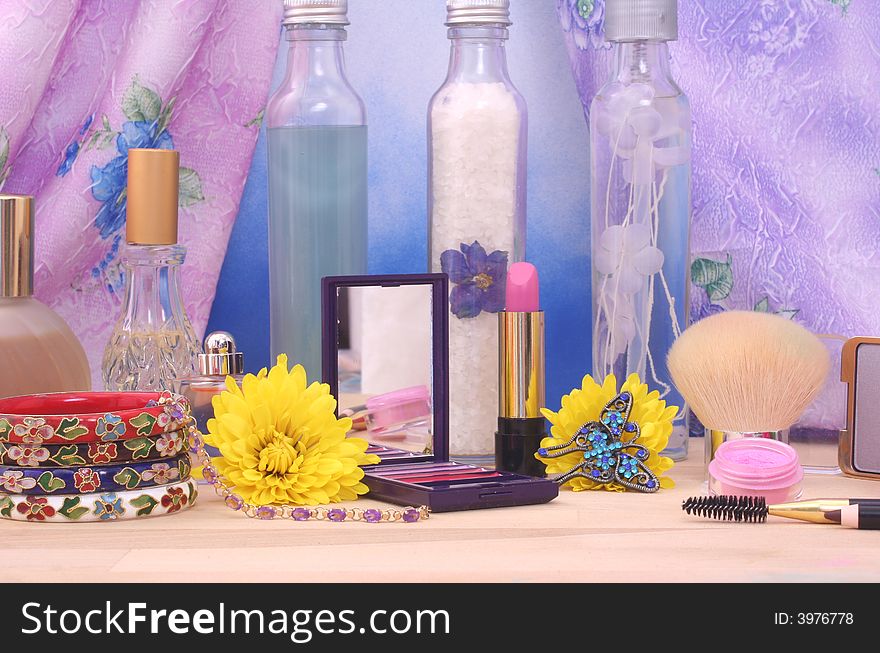 Cosmetics and Jewelry With Flowers and Perfume