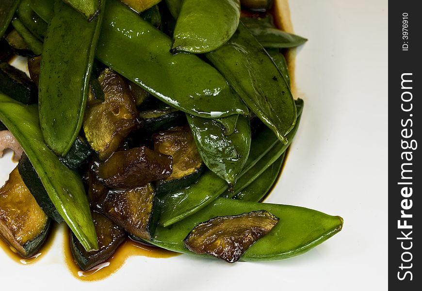 Macro of peas and zucchini in a salad with soy sauce