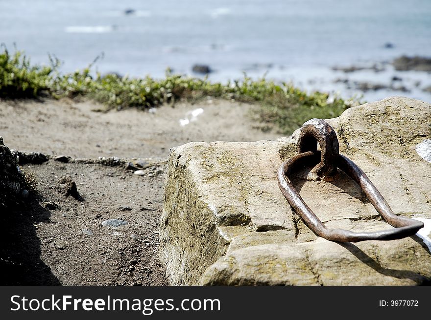 Old mooring slab at the Lizard Peninsular, Cornwall, England, focusing on the mooring looking out to sea...