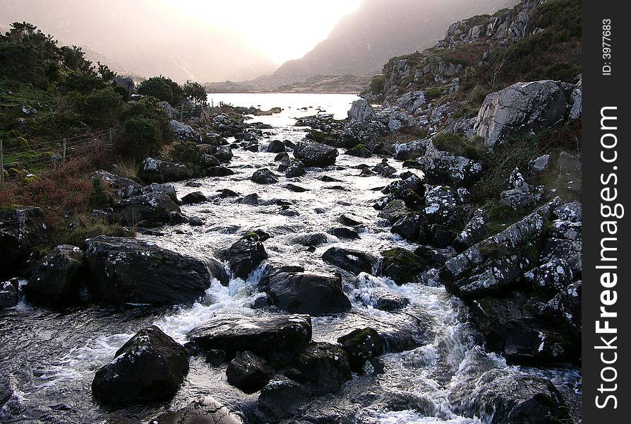 Taken in Kerry, Ireland, looking up a stream surrounded by mountains in winter, great contrast between the rocks and water. Taken in Kerry, Ireland, looking up a stream surrounded by mountains in winter, great contrast between the rocks and water