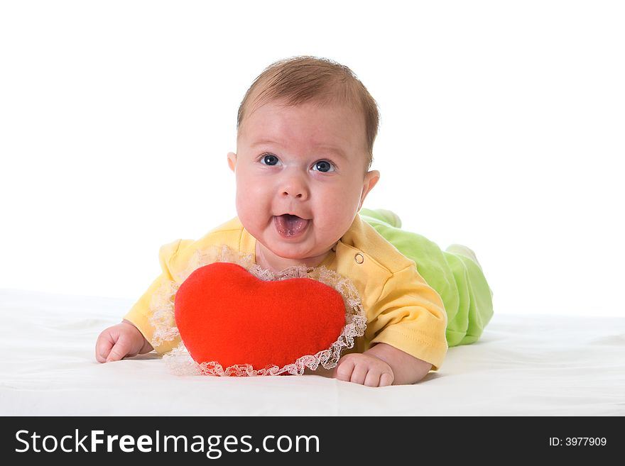 Baby with a soft toy in the form of heart isolated