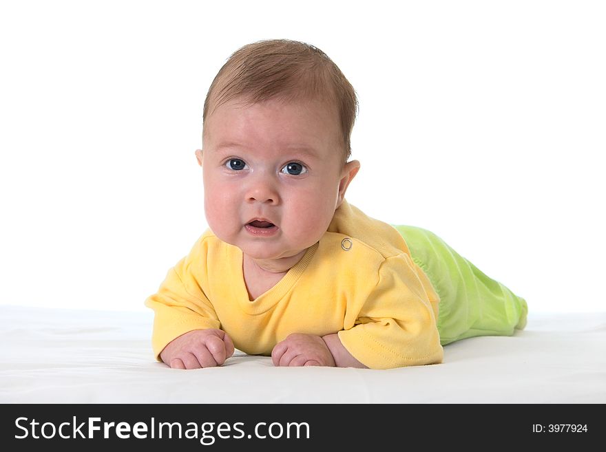 Baby on bed over white