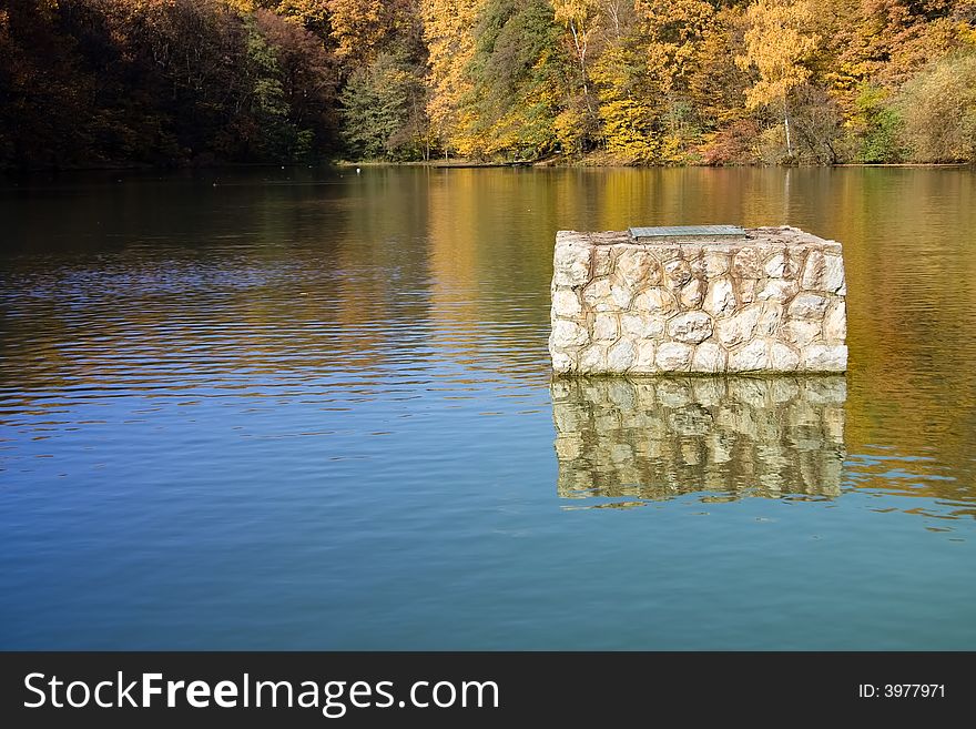 Rocky structure on lake surface