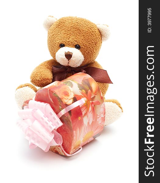 Classic brown Teddy Bear with heart-shaped present