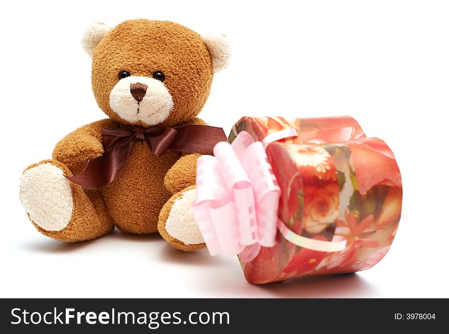 Classic brown Teddy Bear with heart-shaped present