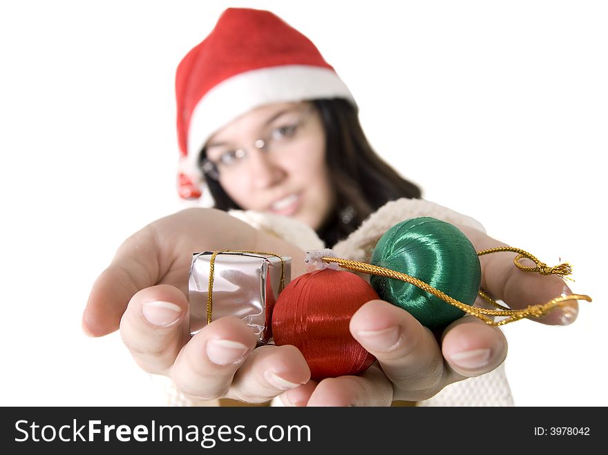 Girl holding christmas tree decorations