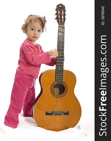 Young girl holding a guitar. Young girl holding a guitar