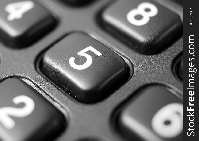 Close up on the keypad of a calculator - shallow depth of field and focus on number five