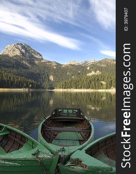 Three boats for fishing on the mountain lake