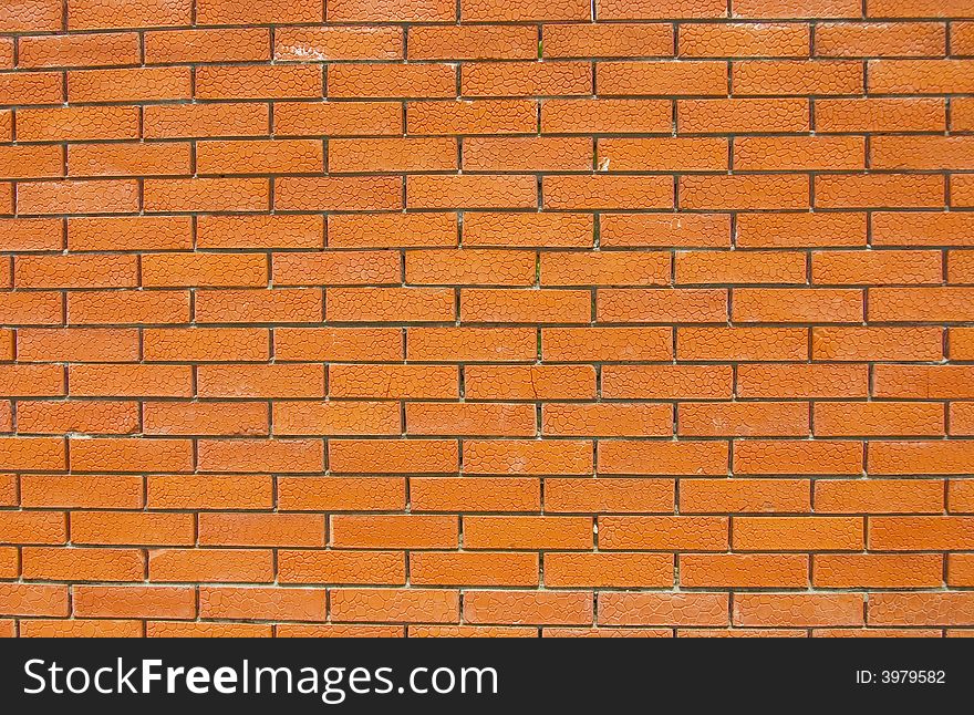 Background from a red-orange wall of accurate bricks. Background from a red-orange wall of accurate bricks