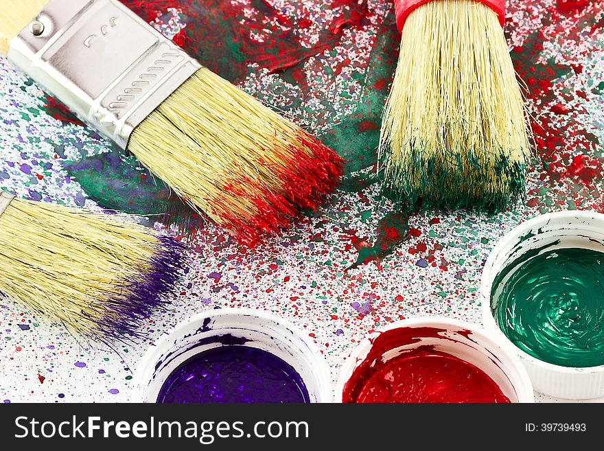 Close up of colorful paint and brushes. Close up of colorful paint and brushes