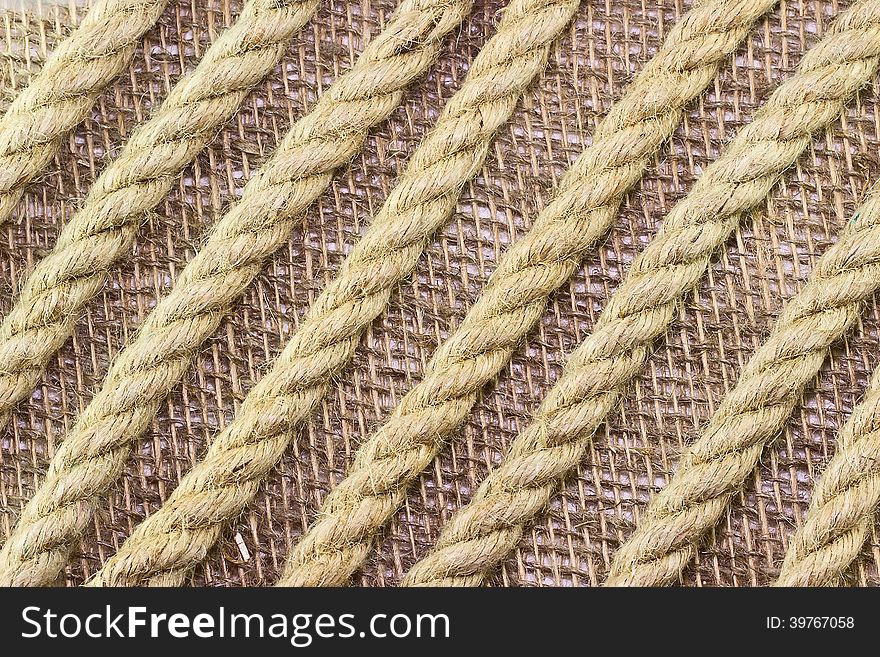 Jute Rope On Burlap Background