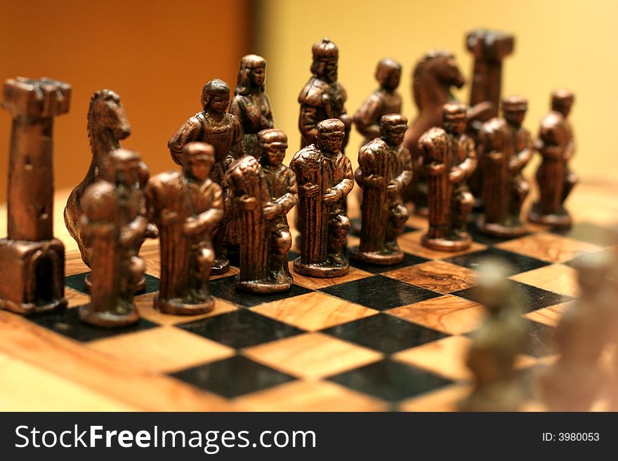 Copper and wood chess. Black figures.