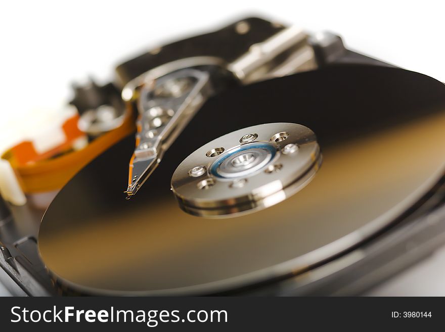 Modern opened hard disk drive over a white surface