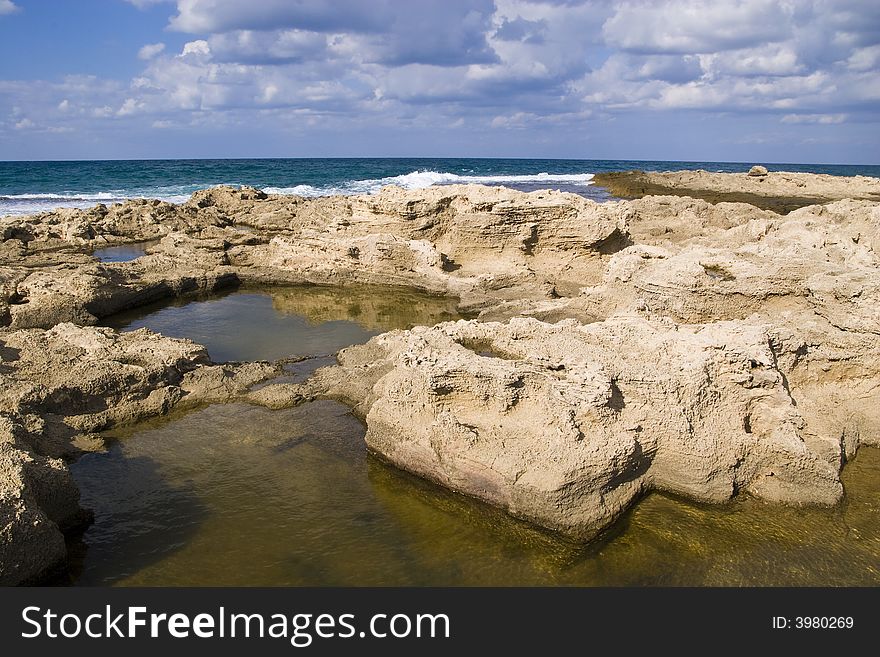 Sea water gathered in small rocky pools. Sea water gathered in small rocky pools.
