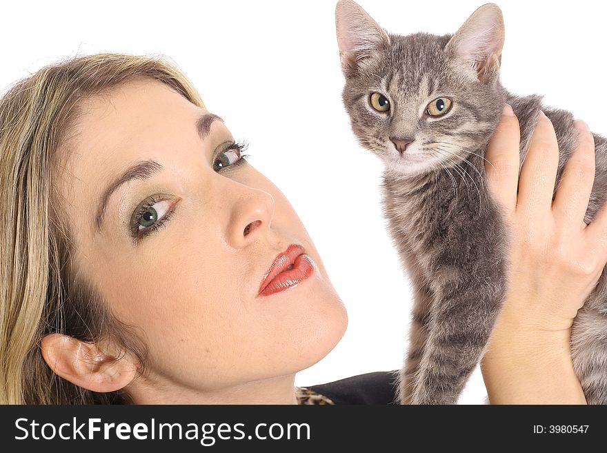 Kissing her kitten isolated on white