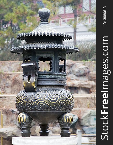 An ancient bronze lantern on the grounds of the Summer Palace in Beijing. An ancient bronze lantern on the grounds of the Summer Palace in Beijing