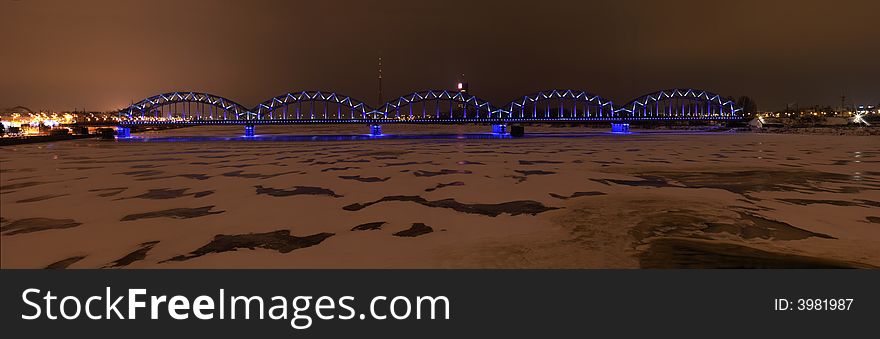 Night scene panorama of illuminated railroad bridge