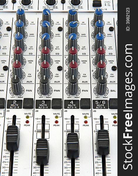 Faders and knobs of a sound mixer for audio recording. Faders and knobs of a sound mixer for audio recording.
