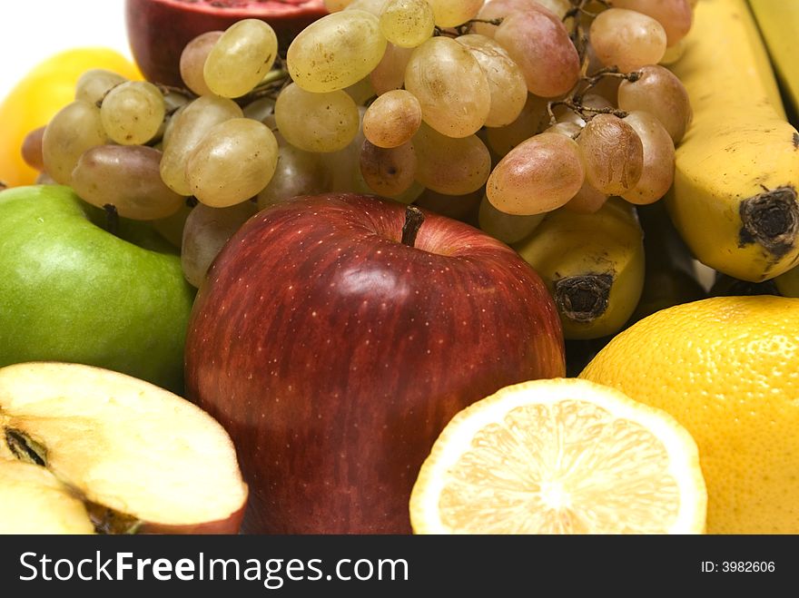 Fruit background. Apple, grape, banane, pomegranate, lemon.