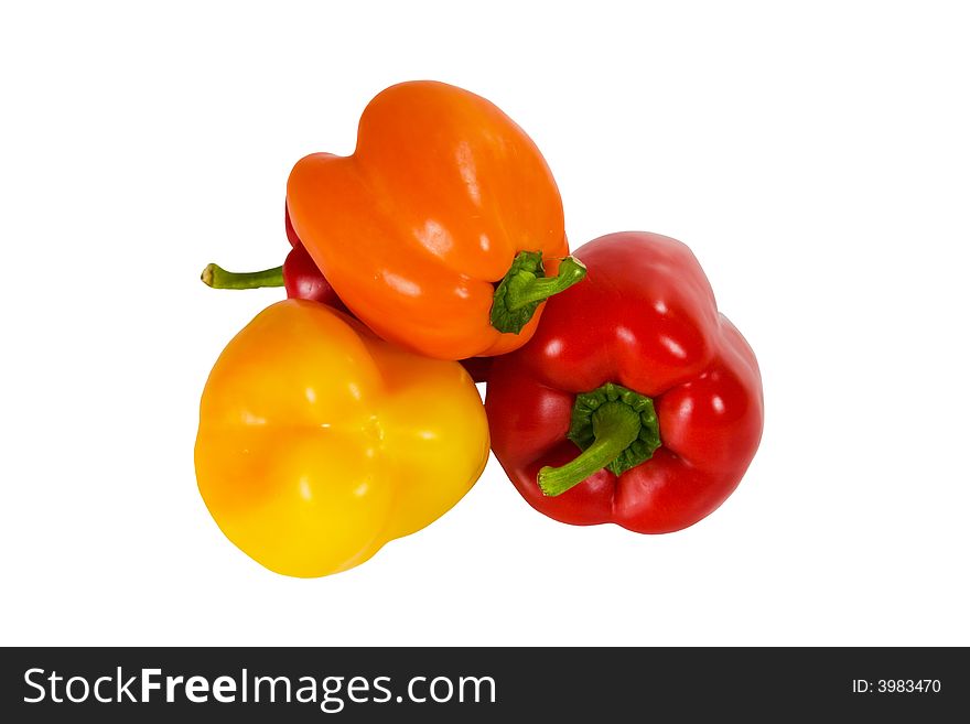 Red, yellow and orange sweet peppers isolated on white