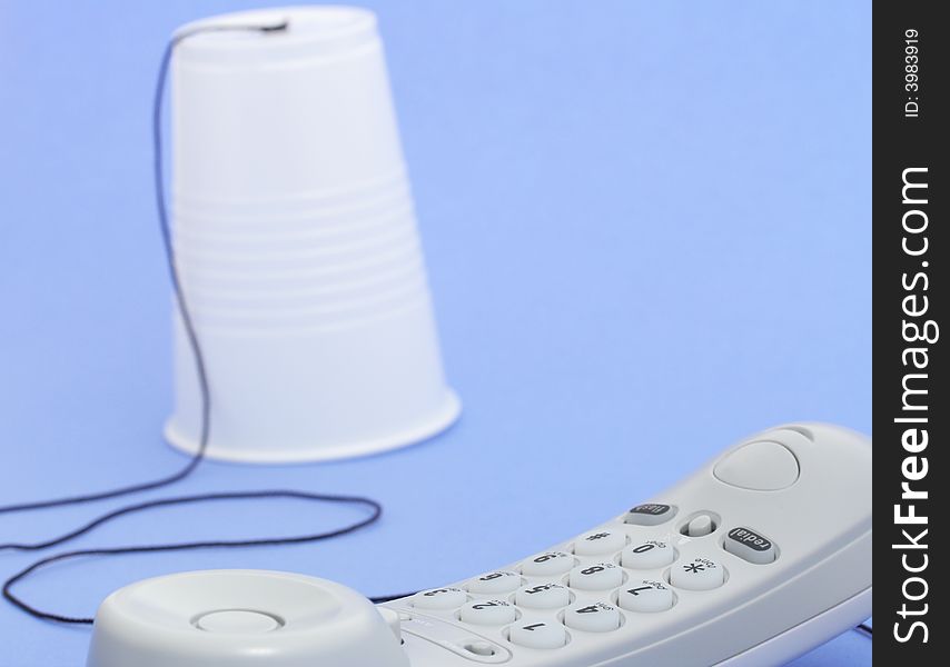 Photo of a telephone over a blue background. Photo of a telephone over a blue background