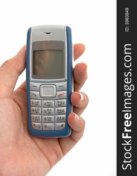 A hand holding a mobile phone over a white background