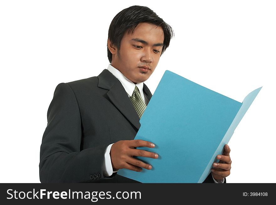 A man looking at a folder over a white background. A man looking at a folder over a white background