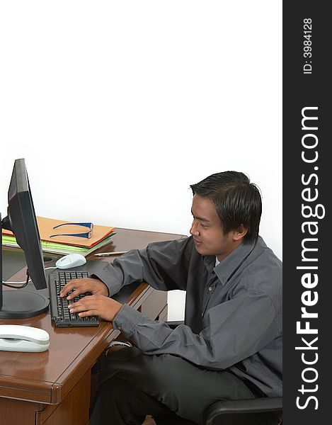 A man working on his desktop computer. A man working on his desktop computer