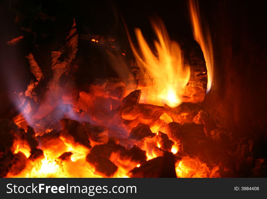 Fire time... firewood in fireplace... red and black place