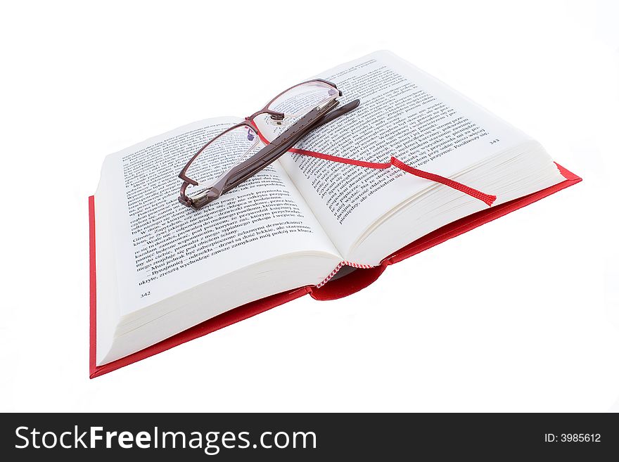 Open red book with glasses isolated on a white background. Open red book with glasses isolated on a white background