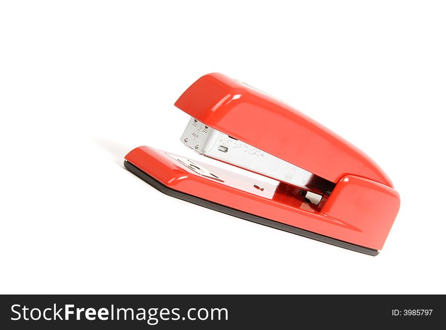 A red stapler isolated on white. A red stapler isolated on white.