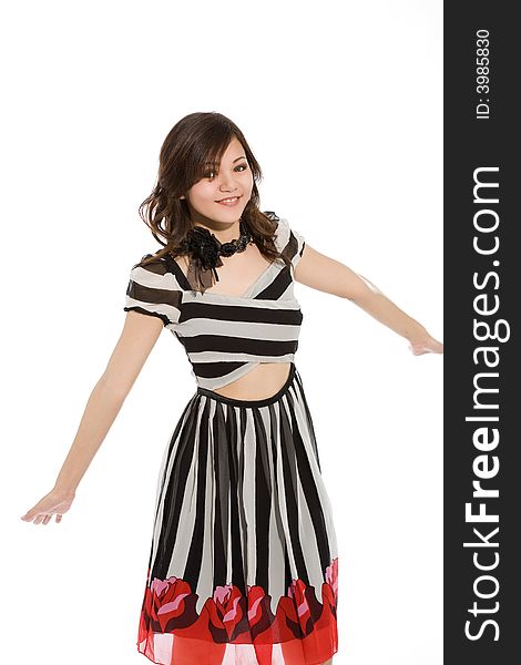 Happy girl in black and white stripes dress stretching hands. Happy girl in black and white stripes dress stretching hands