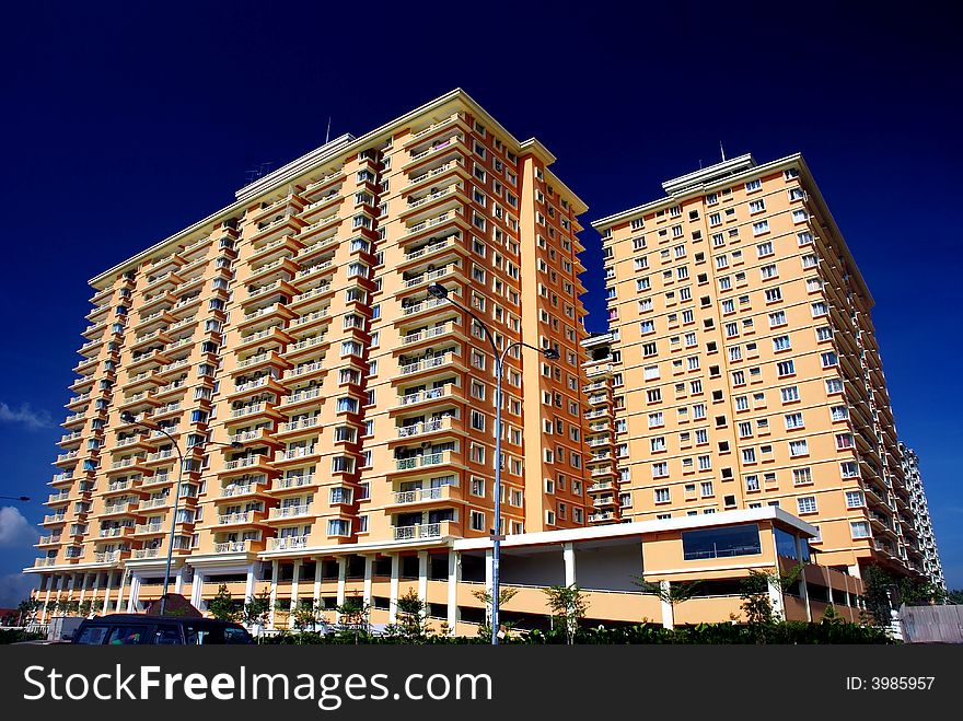 Apartment block on the blue sky background. Apartment block on the blue sky background