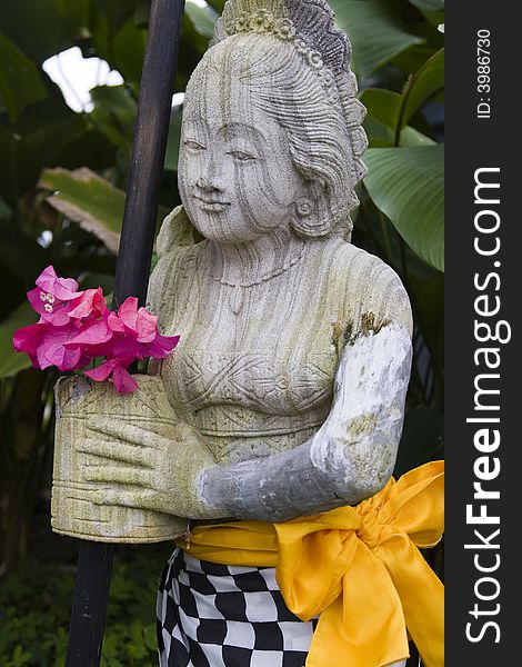 A striated stone statue of a thai lady. A striated stone statue of a thai lady