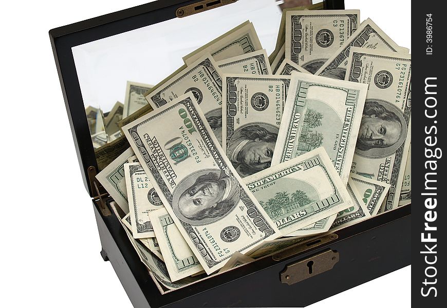 An isolated wooden box full of money
