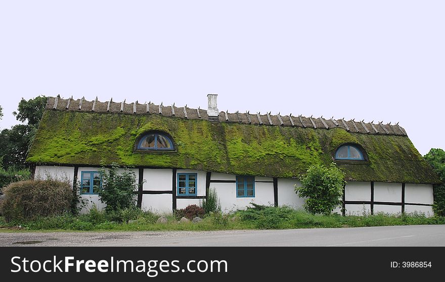 An old danish crooked timberframe house. An old danish crooked timberframe house