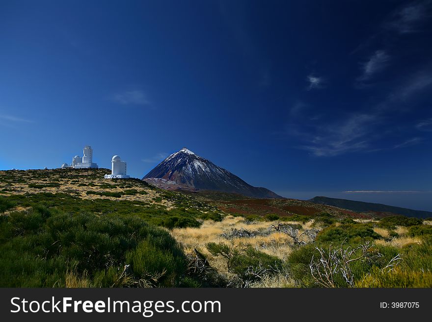 An image of mount Teide and the observation center with a clear blue sky. An image of mount Teide and the observation center with a clear blue sky.